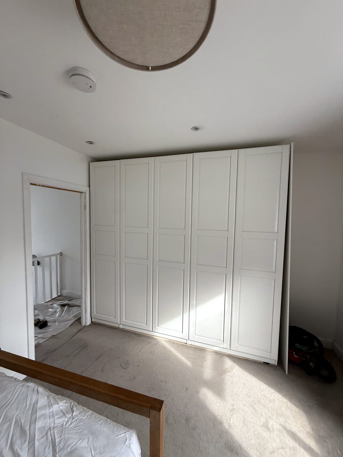 Five panelled doors hung on the frames