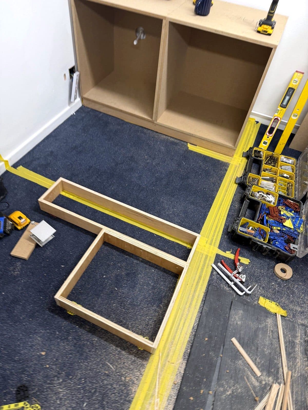 Plinth frames laid out on the office floor