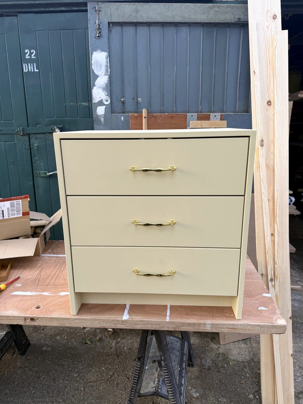 Cream painted vanity unit with three drawers and brass handles