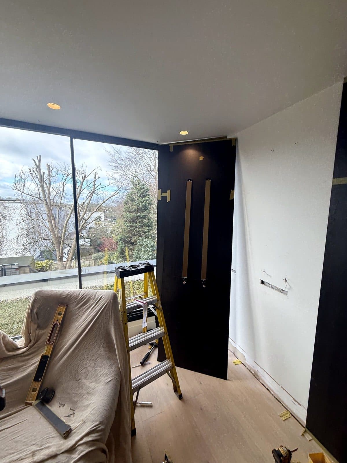 First dark panels fitted in the corner