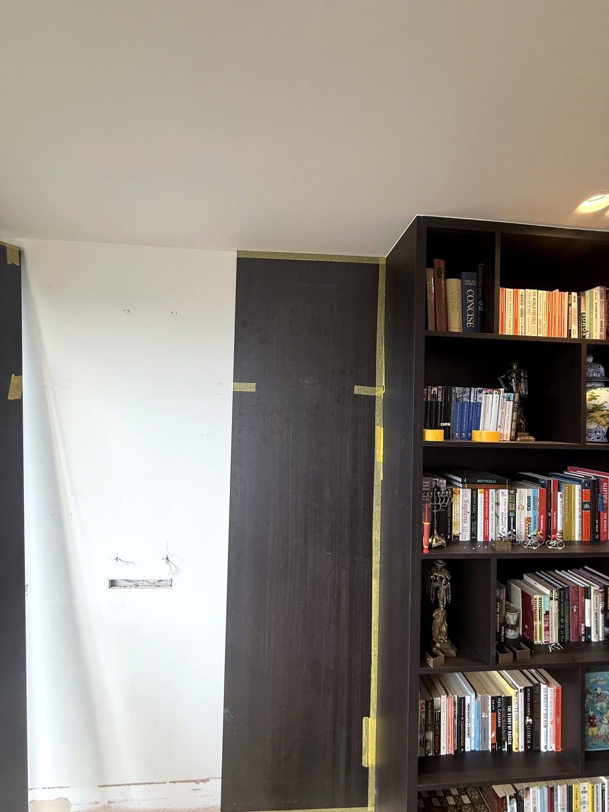 Panels fitted next to the bookcase