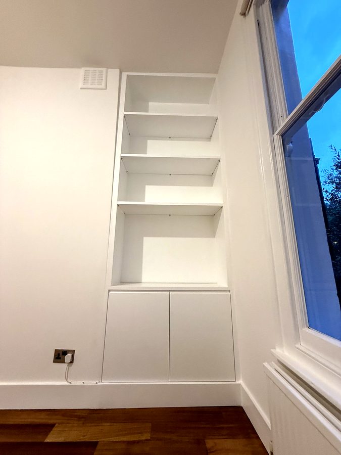 After: a cupboard, open shelves and a lit shelf