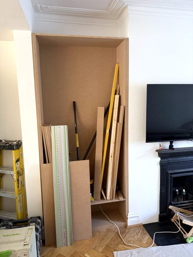 The left alcove lined with MDF, offcuts and a guide rail leaning inside it