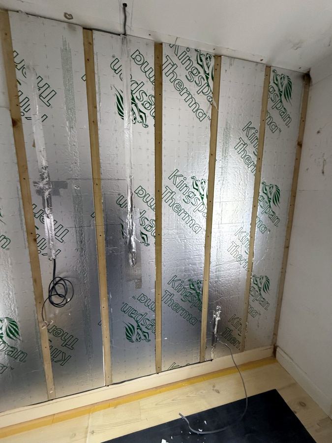 Insulation boards between battens on the outside wall