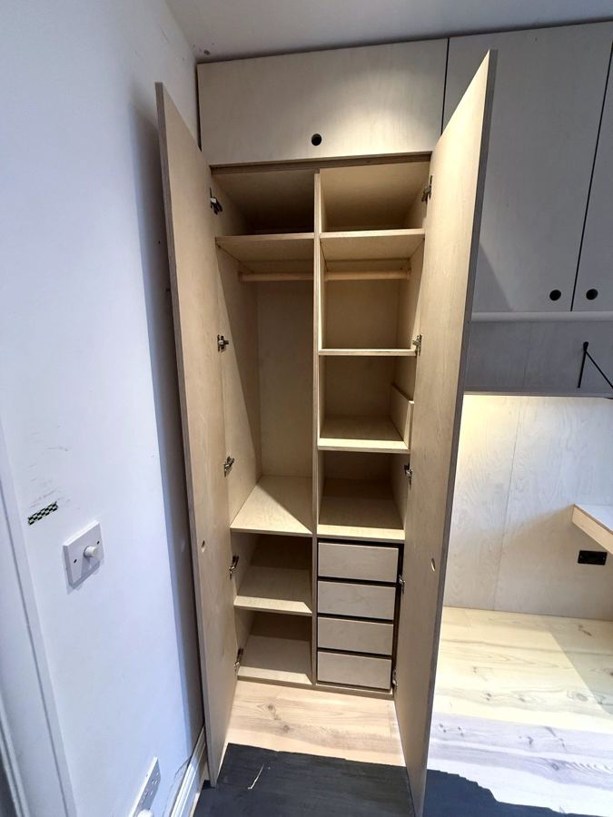 Inside the wardrobe: hanging space, shelves and drawers