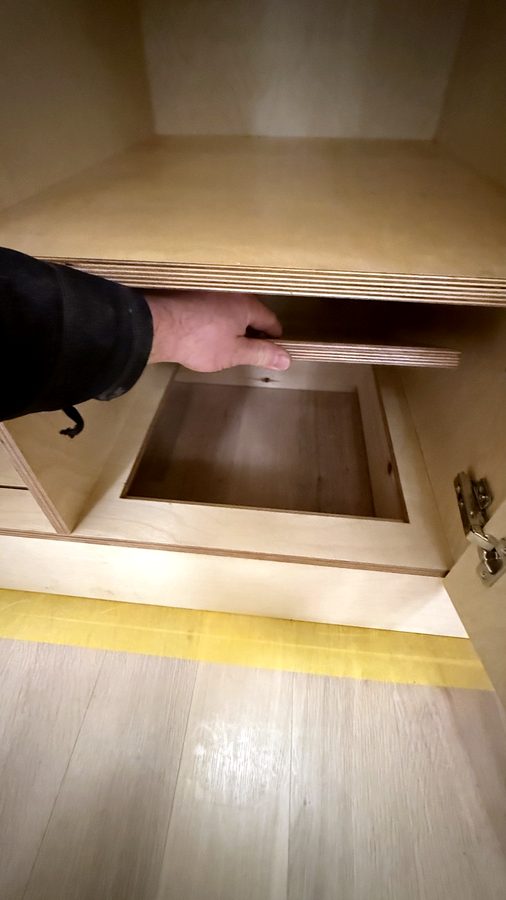 A panel lifted out, the box underneath