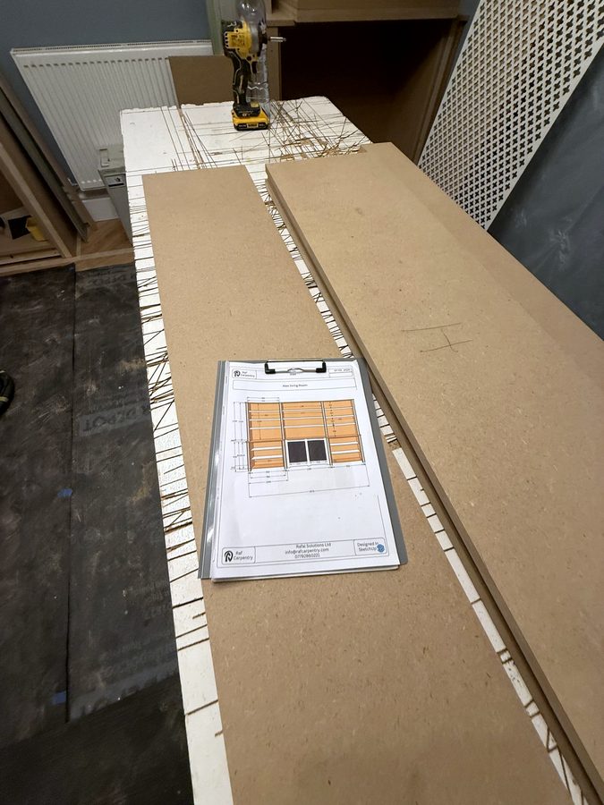 The board plan clipped on the bench