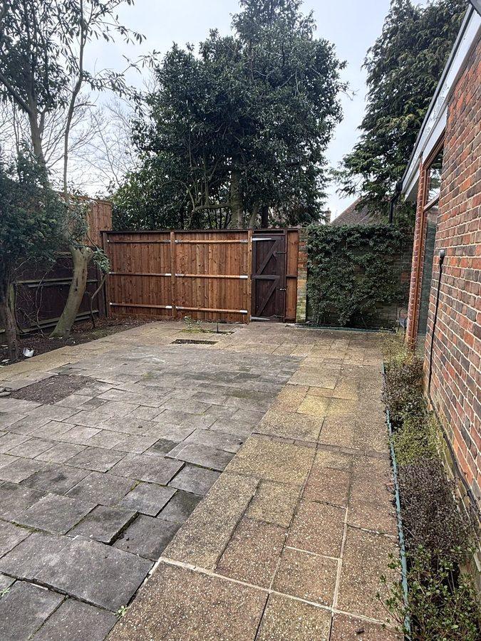 Fence and gate across the back of the patio