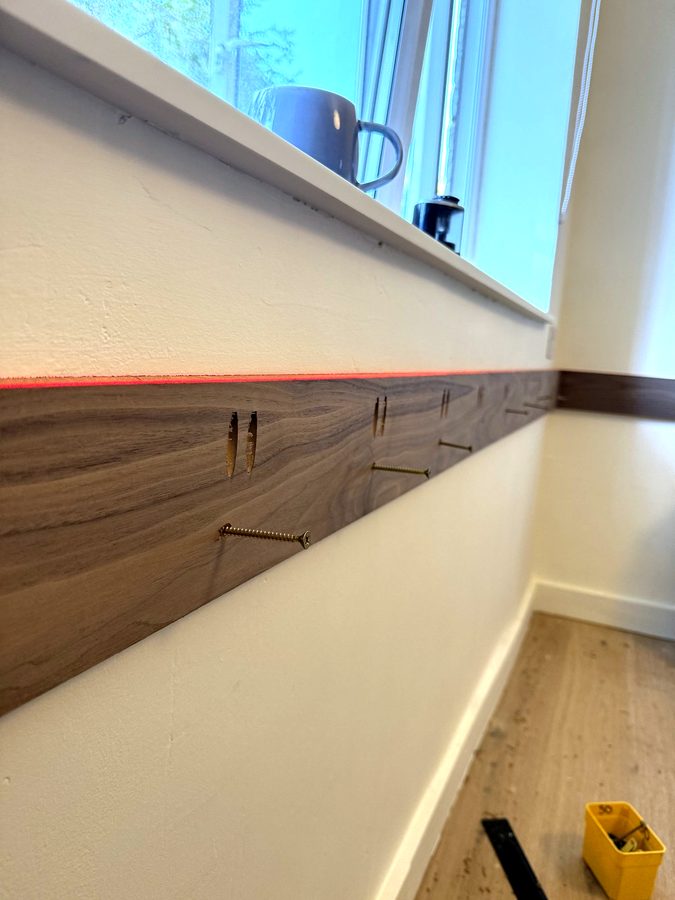The laser line along the wall