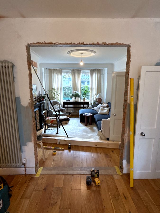 Before: the opening with rough brick edges and no frame