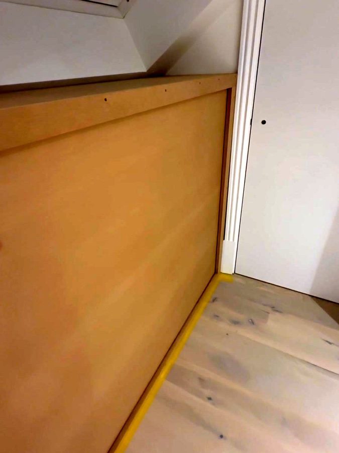 The end of the run, tight to the door architrave