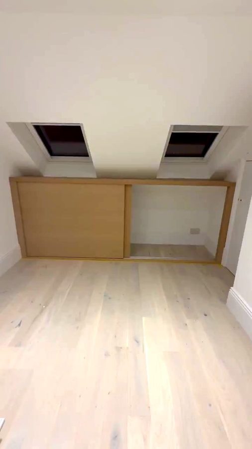 One door slid across, showing the plastered space and the socket behind