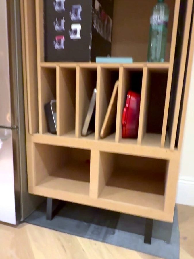 Close-up of the tray dividers and the cubbies under them