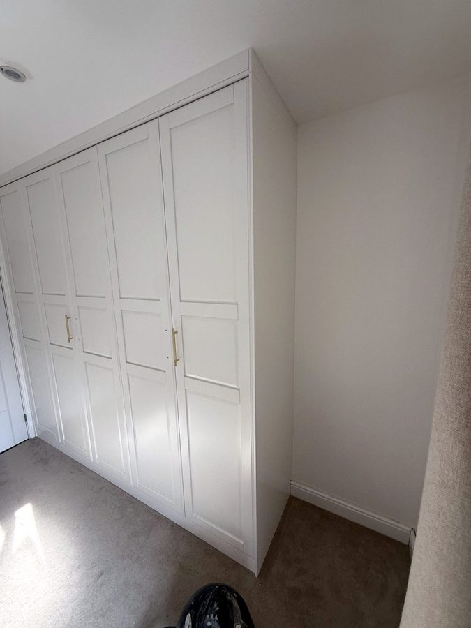 The end of the wardrobe, closed in up to the ceiling