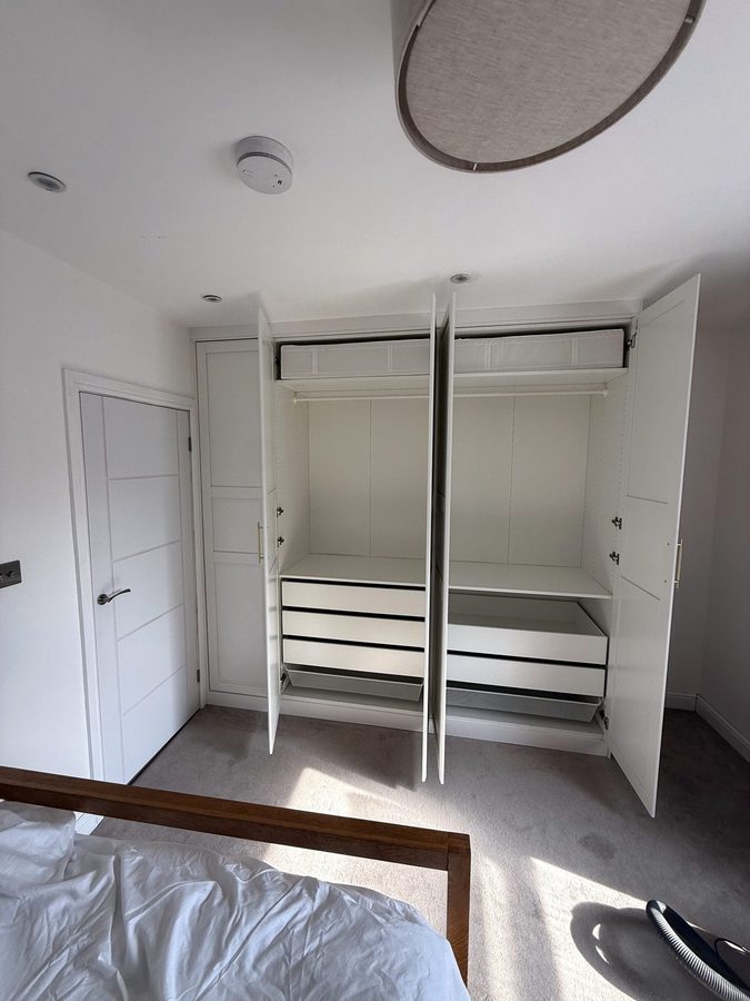 Doors open: hanging rails, shelves and drawers inside