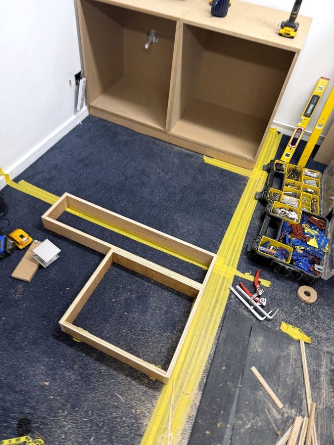 Plinth frames set out along a tape line