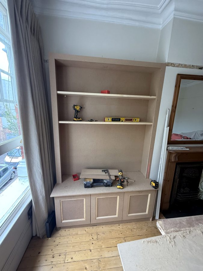 Front frame and shelves going in on the TV side