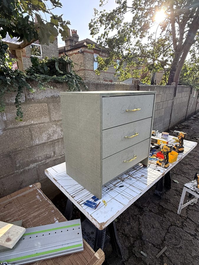 The unit built in green moisture-resistant MDF, before painting