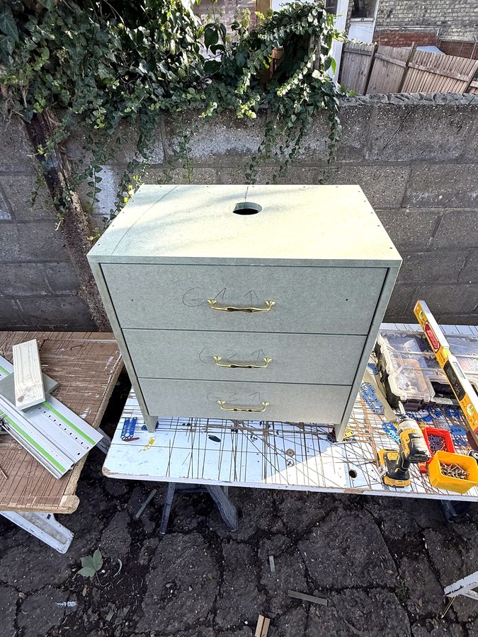 The top with the hole for the waste