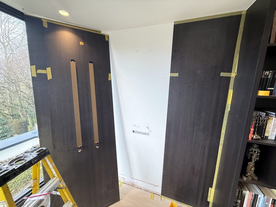 The brass strips set into a panel, the middle of the wall still to do