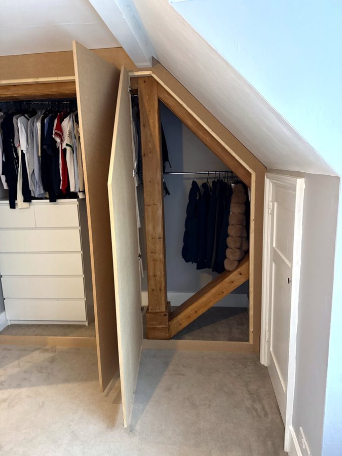 The sloped door open, with the MDF frame round the beam