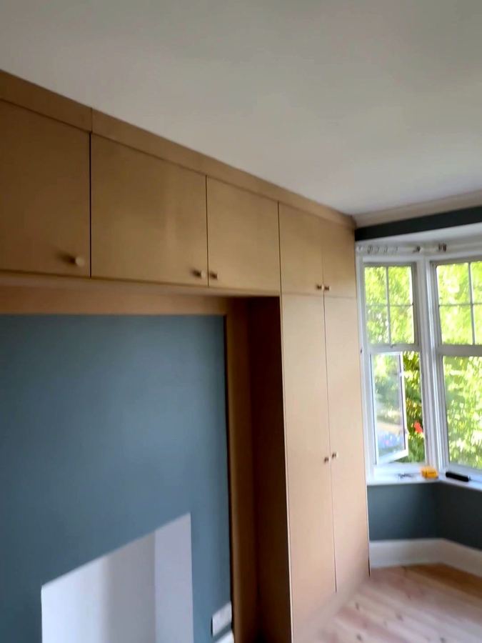 Overhead cupboards running towards the bay window