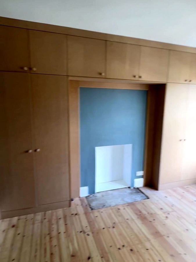 The whole wall with the fireplace in the middle