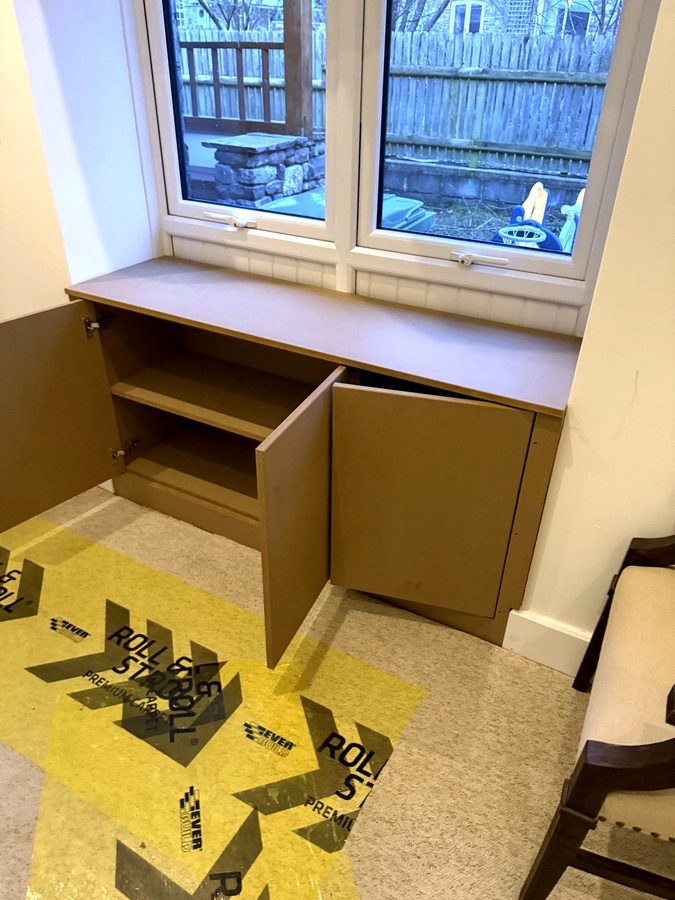 Two doors open, showing the shelf inside