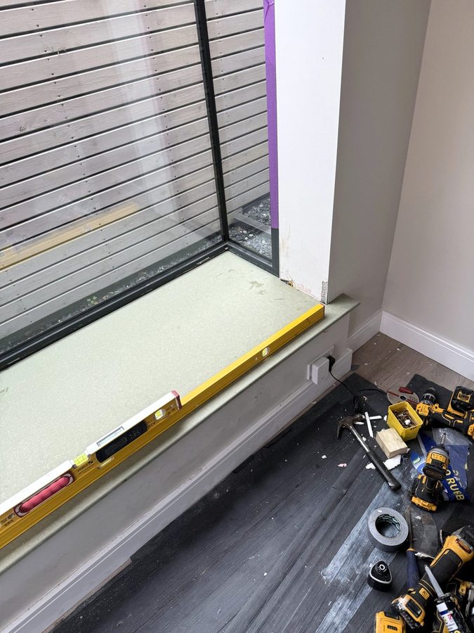 Digital level along the front edge of the new top